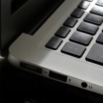 Free Detailed view of a silver laptop showing keyboard and multiple ports. Stock Photo